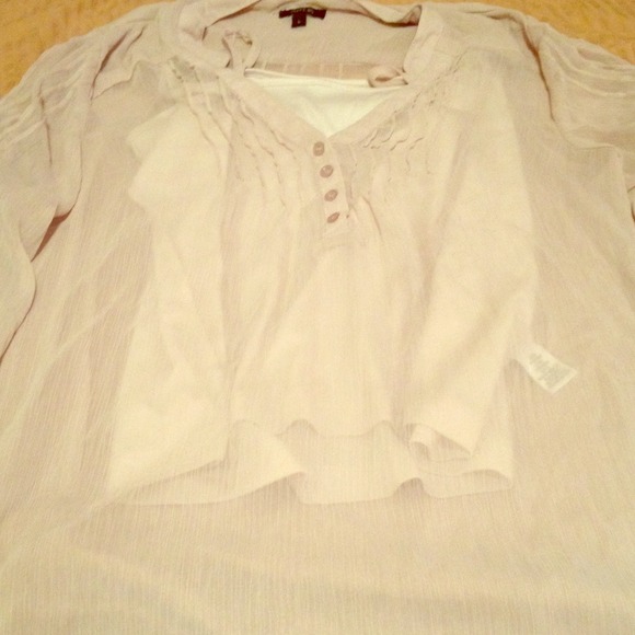 A big poofy beige shirt to go over tights and such