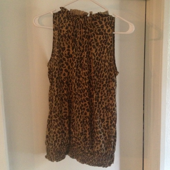 High neckline cheetah blouse.