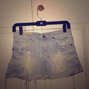 Machine denim destroyed light wash shorts