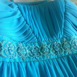 Light blue knee length dress.