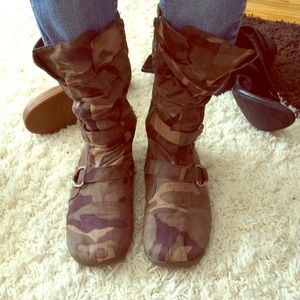 Camo zip up shoes.