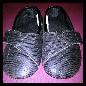 Black metallic toddler shoes