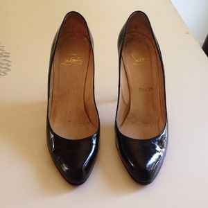 Christian Louboutin patented leather black heels.