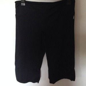Black, knee-length workout shorts.
