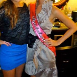 Tan silk dress with black belt and ruffled collar