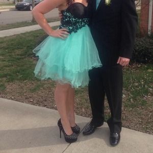 Mint green strapless short prom dress.