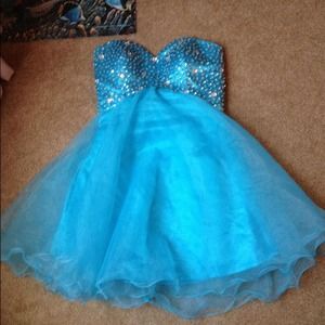 Light blue strapless short prom dress.