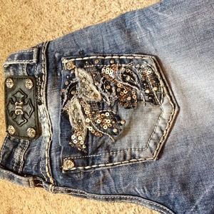 Size 26 boot cut miss me jeans. Lightly worn.