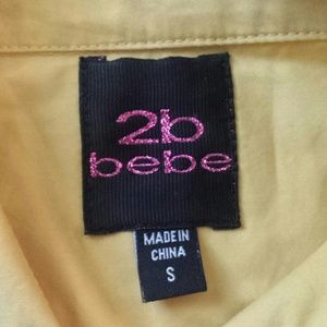 Small yellow BEBE button down shirt