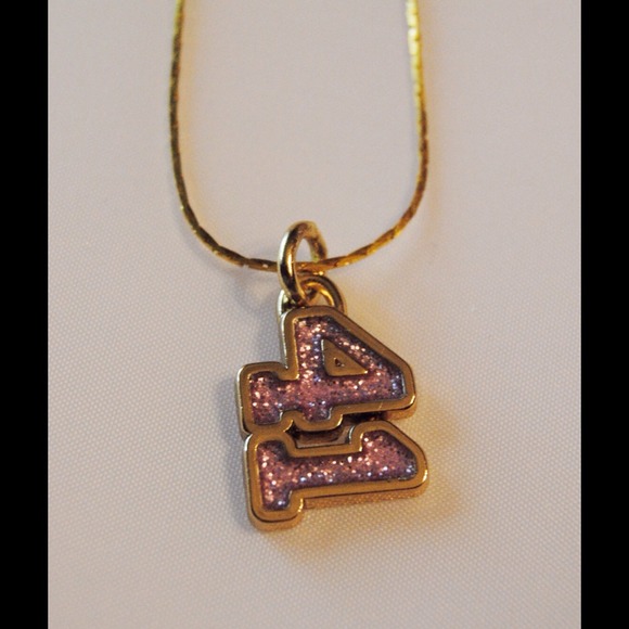COACH sparkly 41 football pendant on gold chain