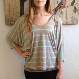 Loose striped quarter- sleeved top