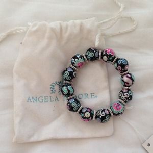 Angela Moore bracelet 2.75" diameter. Never worn.
