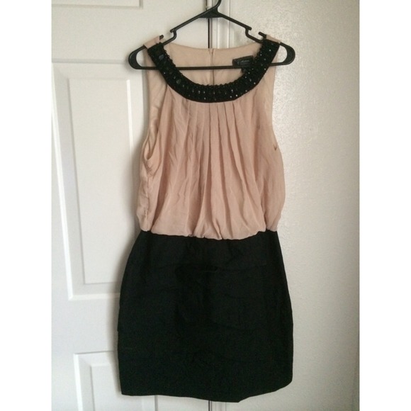 Beige and black skirt dress.....