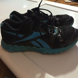 Blue and black reebok vibe tech sneakers