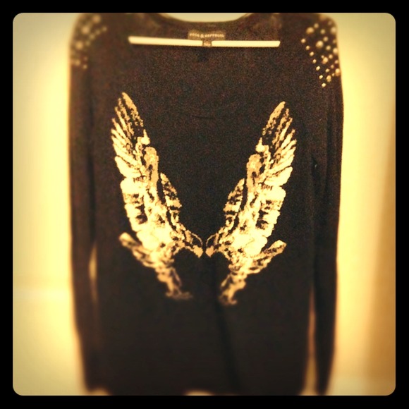 Black long sweater with metal detailing