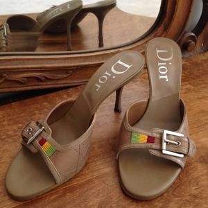 Dior slides with signature color accent.