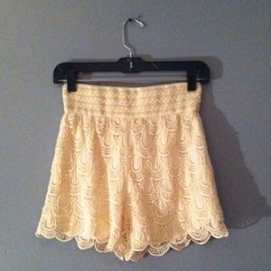 High-waisted creme crotchet shorts.