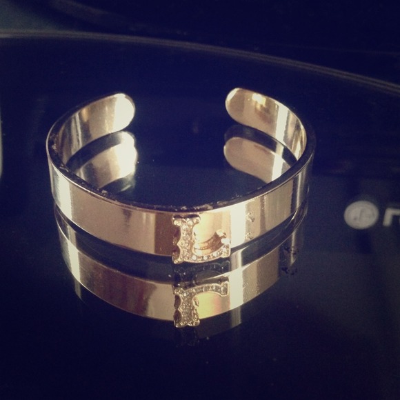 Gold bangle with L