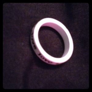 White ring that says love.