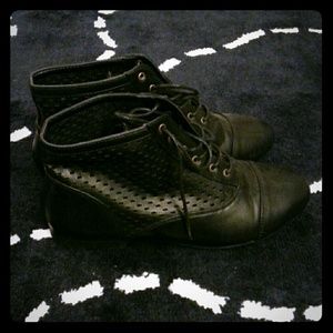 Perforated black boots
