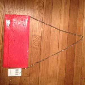 Brand new coral Carlos Falchi clutch purse