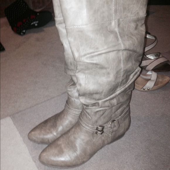 Some grey buckles boots