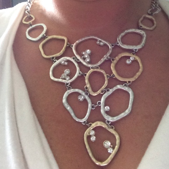 Silver and gold necklace with diamonds.