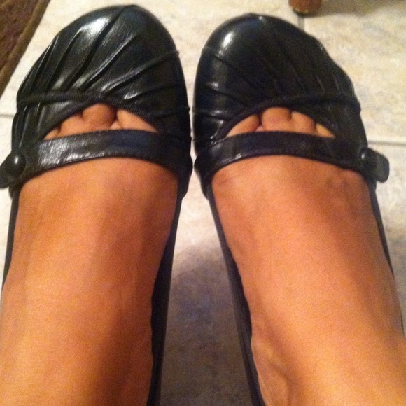 Black slip ons with a small wedge heel