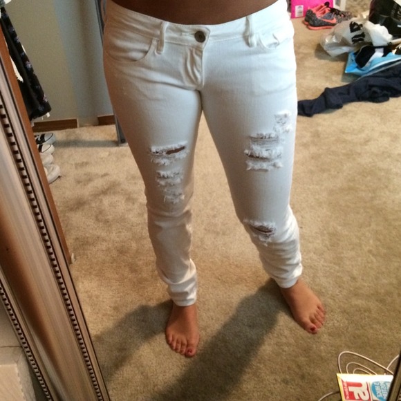 Distressed white jeans
