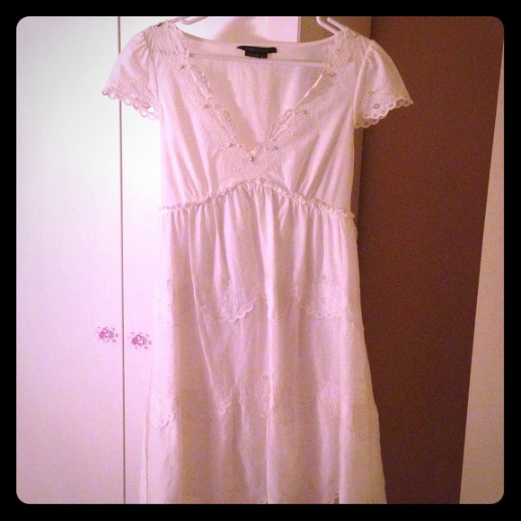Beautiful White BCBG Dress with embroidery.