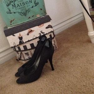 Gray and black heels with bows