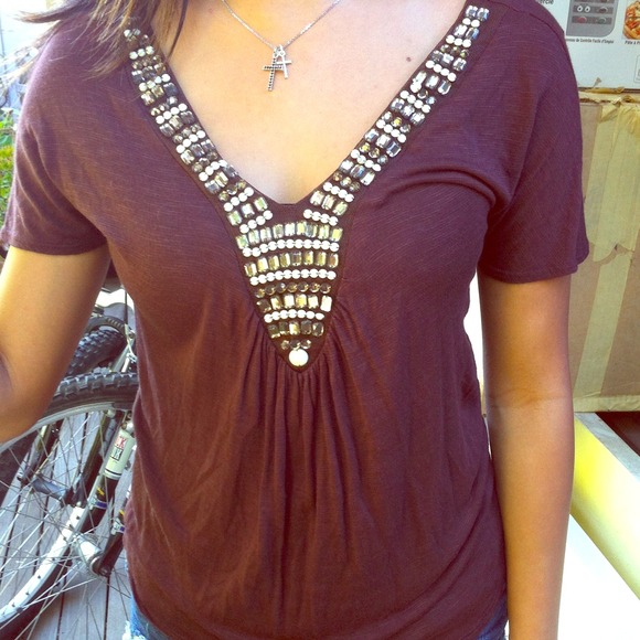 Chocolate brown top with beaded detailing.