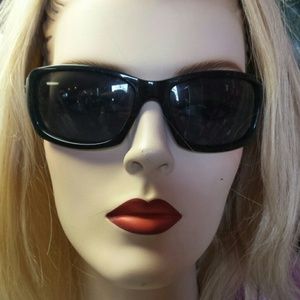 Oakley women's sunglasses. Black. Style is tangent