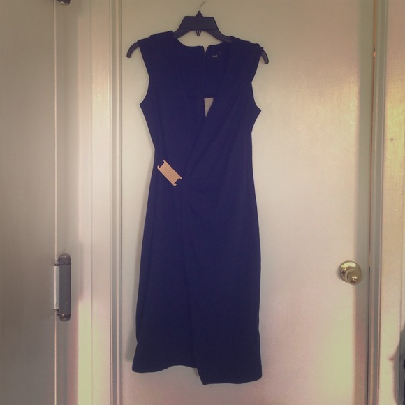 Midnight blue wrap dress look with metal hardware