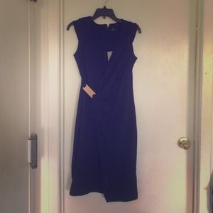 Midnight blue wrap dress look with metal hardware