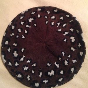 Dark brown leopard beret. Never worn.