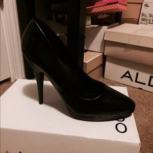 Black leather pumps