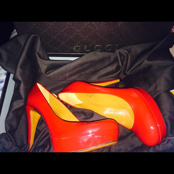 Gucci red patent leather peep toe sandals.