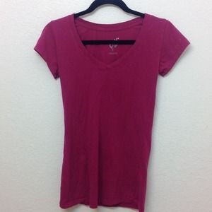 Fuchsia V-neck shirt.
