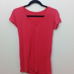 Coral V-neck shirt.