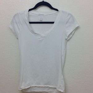 White V-neck shirt.