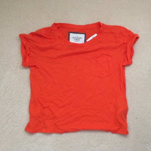 Bright orange cropped top with chest pocket