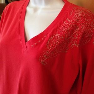 Autumn orange long sleeve top with embroidery.