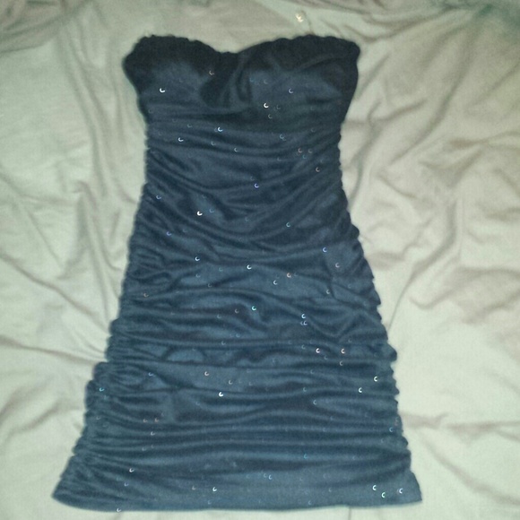 Black and glitter strapless dress.