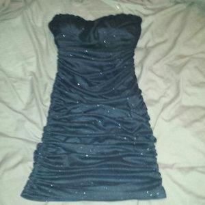 Black and glitter strapless dress.