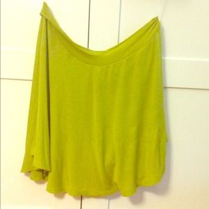 Lime green one-sleeve shirt.