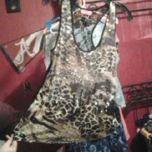 Animal print tops with sequins. Says XL fits like