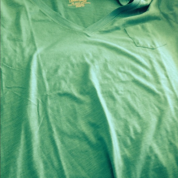 2 shirts. 1 v-neck tee shirt 1 white button up