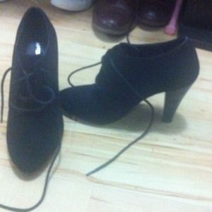 Black inclosed heels with ties in the front