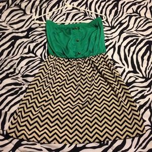 Chevron style dress with a green top